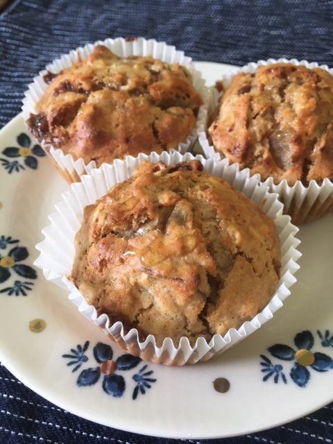 Three muffins on a white plate.